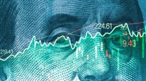 closeup benjamin franklin face usd banknote with stock market chart graph currency exchange global trade forex concept 1 e1692951713336